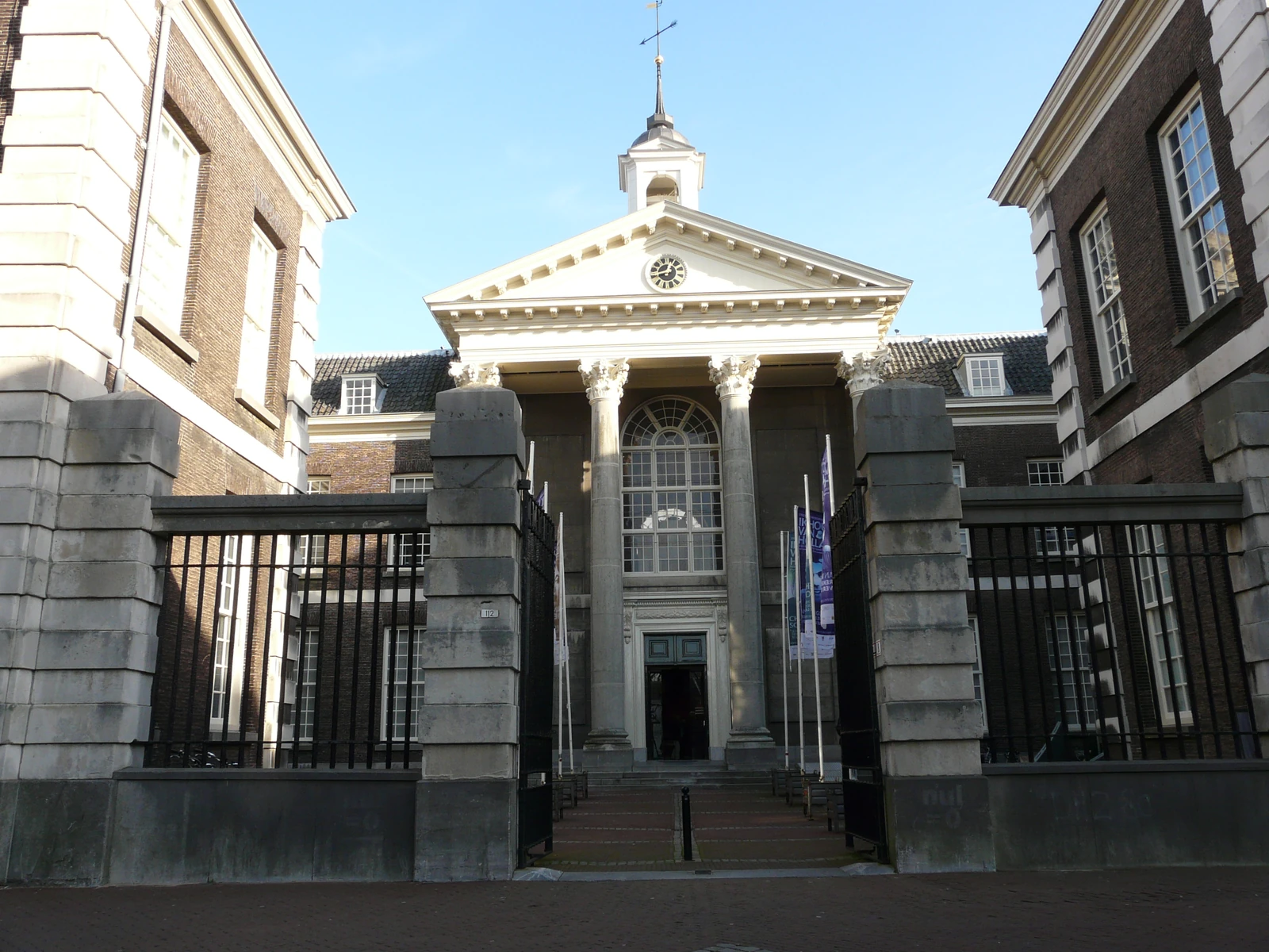The entrance to Stedelijk Museum Schiedam with columns and a gate.