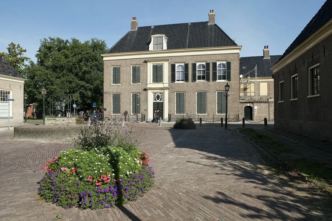 Historic façade of the Drents Museum on a square in Assen.